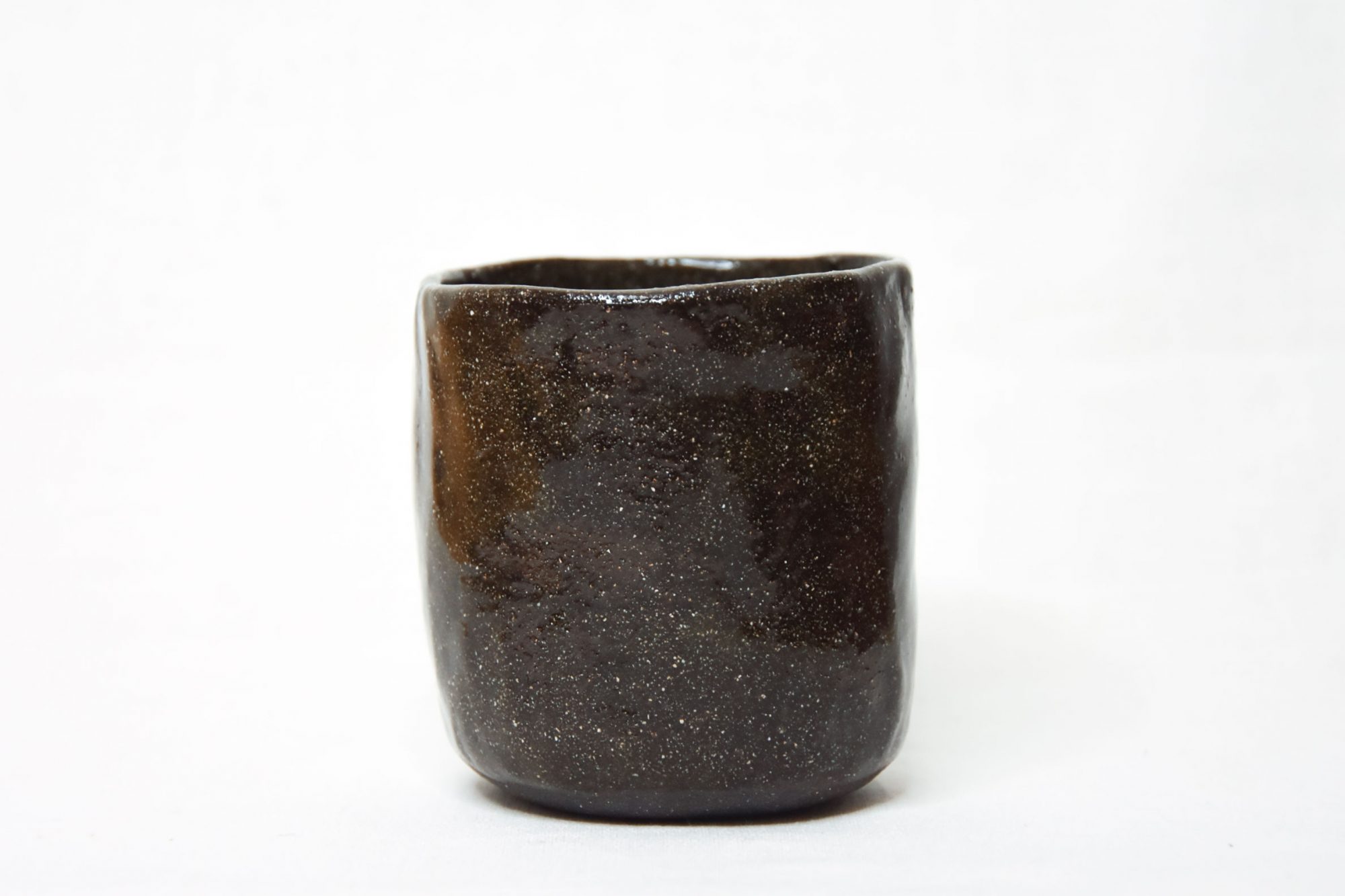 Black stoneware tea cup